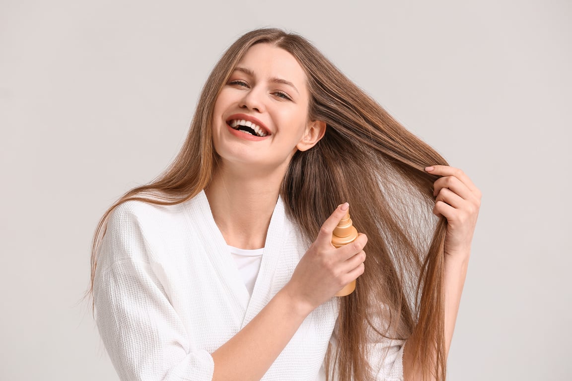 Young Woman with Hair Spray